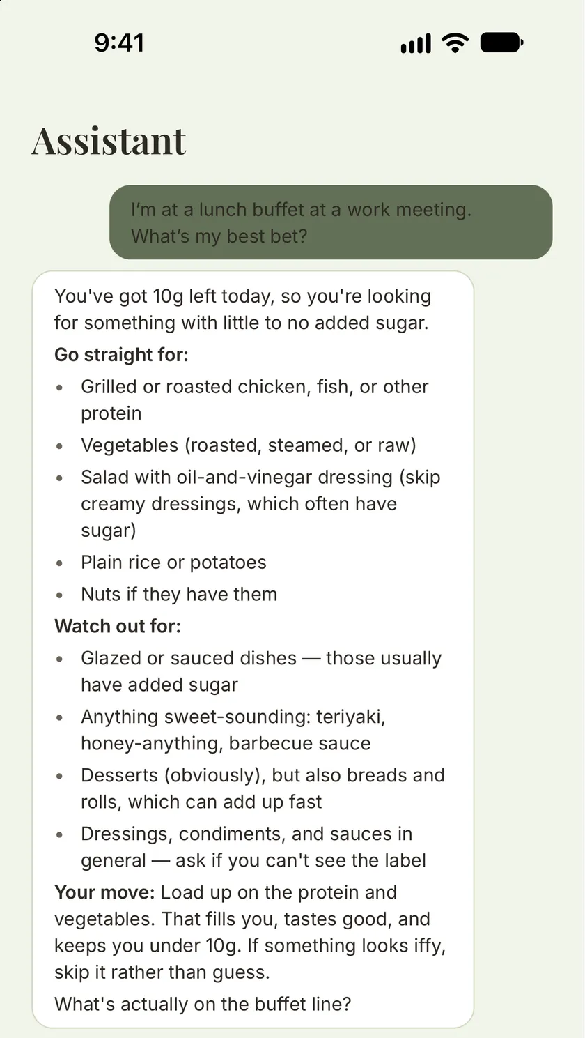 The assistant answering “I’m at a lunch buffet at a work meeting. What’s my best bet?” with “You’ve got 10g left today”, then what to go straight for and what to watch out for